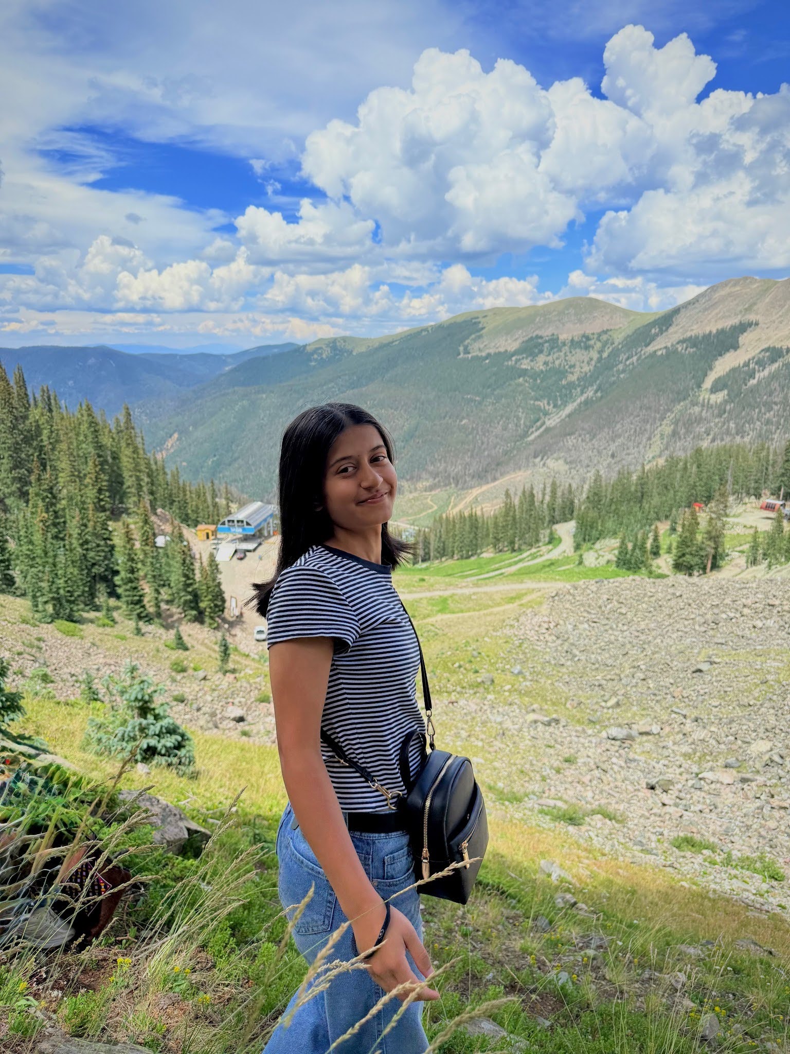Eshwa, an ASRF student, standing on a mountain overlook