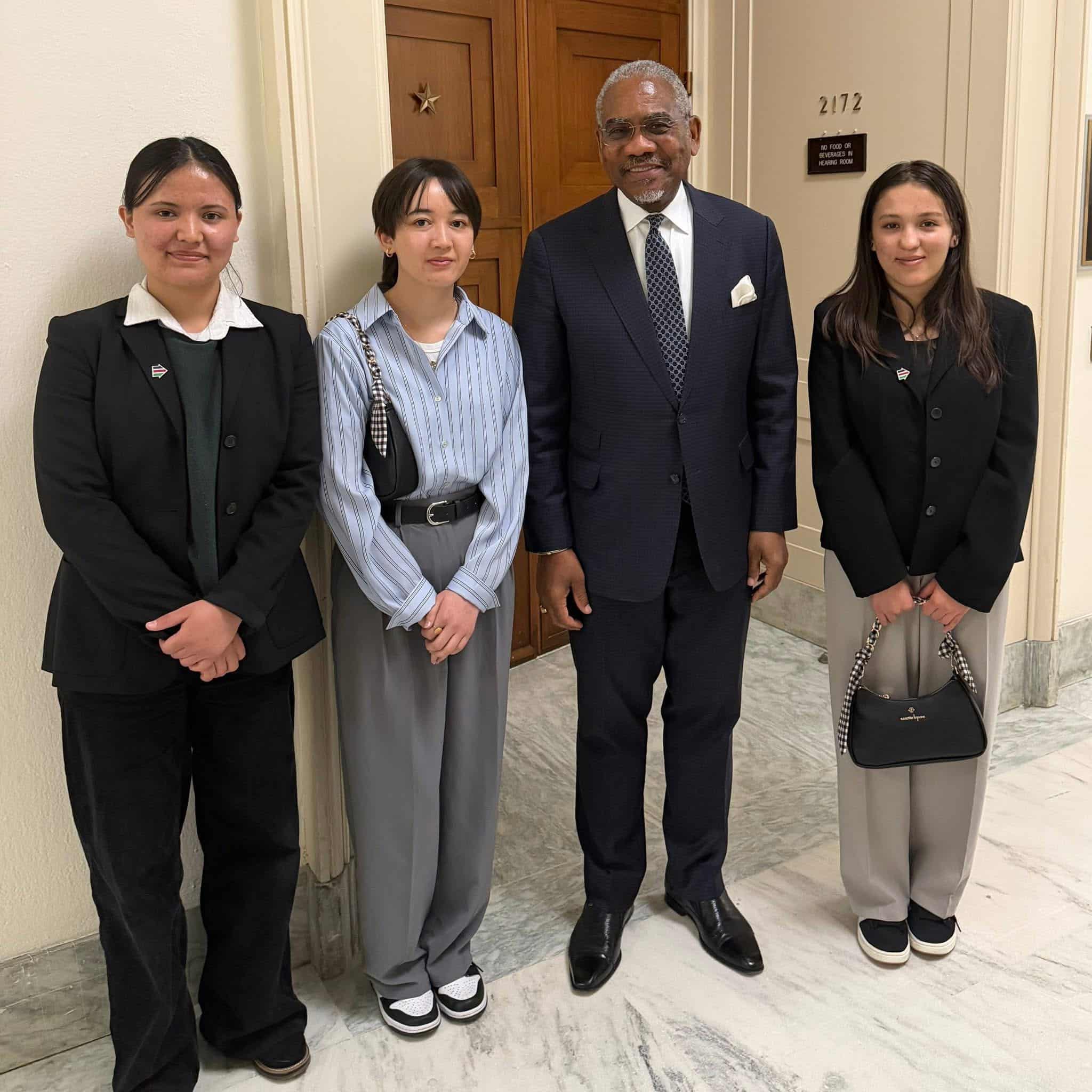ASRF students outside the Foreign Affairs Committee room with Ranking Member Gregory Meeks